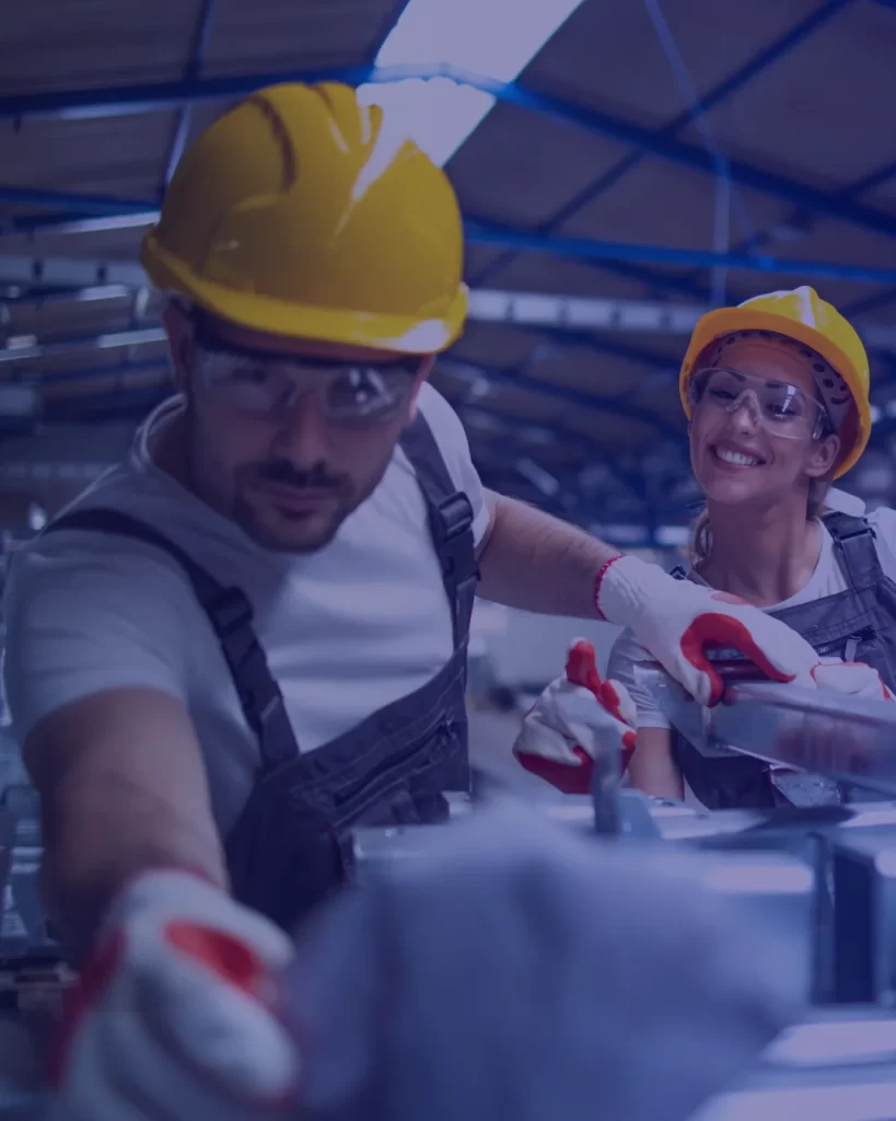 Skilled manufacturing workers operating machinery and assembly lines